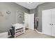 Functional room featuring a changing table, closet, and neutral walls at 1572 Pixley St, Charleston, SC 29414