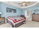 Bedroom featuring a ceiling fan, with ensuite bathroom access at 1572 Pixley St, Charleston, SC 29414