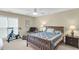 Cozy bedroom featuring a ceiling fan, natural light, a comfortable chair, and neutral-toned walls and carpet at 1572 Pixley St, Charleston, SC 29414