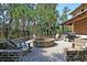 Outdoor fire pit area with ample seating and grilling space, perfect for entertaining at 1572 Pixley St, Charleston, SC 29414