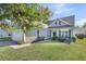 Charming single-Gathering home with manicured lawn, attached garage, and traditional architectural details at 1572 Pixley St, Charleston, SC 29414