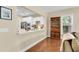 Open kitchen view with granite countertops, white cabinets, and stainless steel appliances at 1572 Pixley St, Charleston, SC 29414