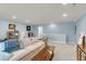 Spacious living area featuring blue walls, recessed lighting, and comfortable seating, creating a welcoming atmosphere at 1572 Pixley St, Charleston, SC 29414
