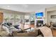 Inviting living room with fireplace, comfortable seating, access to the patio, and a view into the office space at 1572 Pixley St, Charleston, SC 29414