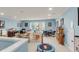 Bright and airy living area with large windows, playroom elements, and cozy seating, creating a versatile space at 1572 Pixley St, Charleston, SC 29414