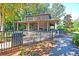 Outdoor pavilion with brick fireplace and picnic tables, set in a wooded area at 1572 Pixley St, Charleston, SC 29414