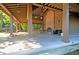 Under a pavilion with picnic tables, fireplace and ceiling fans for comfortable outdoor gatherings at 1572 Pixley St, Charleston, SC 29414