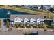 Aerial view of beautiful townhomes in a community with a pond and lush landscaping at 1614 Prince Edward St, Mount Pleasant, SC 29466