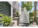 Outdoor stairs and patio area enhance this home's appeal at 1614 Prince Edward St, Mount Pleasant, SC 29466