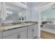 Bathroom features dual sinks, granite countertops, and a walk-in shower at 1614 Prince Edward St, Mount Pleasant, SC 29466