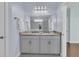 Bright bathroom with double sink vanity, granite countertop, and decorative lighting at 1614 Prince Edward St, Mount Pleasant, SC 29466