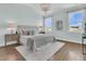 Bright bedroom features a chandelier, two windows, and hardwood floors at 1614 Prince Edward St, Mount Pleasant, SC 29466