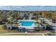 Expansive community pool with palm trees and plenty of seating for residents at 1614 Prince Edward St, Mount Pleasant, SC 29466