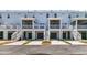 Townhome exterior with garages and outdoor living spaces at 1614 Prince Edward St, Mount Pleasant, SC 29466