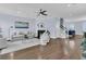 Bright living room features a fireplace, stylish furnishings, and hardwood floors, creating a warm and inviting space at 1614 Prince Edward St, Mount Pleasant, SC 29466