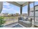 Screened-in porch with comfortable seating, overlooking a pond at 1614 Prince Edward St, Mount Pleasant, SC 29466