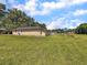 Spacious backyard with lush green lawn and raised garden beds at 1705 Sulgrave Rd, Charleston, SC 29414