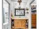 Bathroom with a large mirror, chandelier, and beautiful wooden vanity with ample storage at 1705 Sulgrave Rd, Charleston, SC 29414