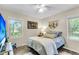 Cozy bedroom with natural light, warm neutral tones, and hardwood floors at 1705 Sulgrave Rd, Charleston, SC 29414