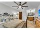Spacious bedroom with wood flooring that leads to a bathroom with wooden vanity at 1705 Sulgrave Rd, Charleston, SC 29414