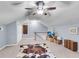 Spacious bonus room with unique ceiling fan, carpeted floors, and stylish decor and furnishings at 1705 Sulgrave Rd, Charleston, SC 29414