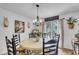 Charming dining room features elegant chandelier and natural light at 1705 Sulgrave Rd, Charleston, SC 29414