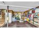 Spacious garage featuring 'Welcome' mats, workbench, and ample storage for equipment and tools at 1705 Sulgrave Rd, Charleston, SC 29414