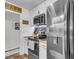 This contemporary kitchen boasts stainless steel appliances, butcher block countertops, and sleek white cabinetry at 1705 Sulgrave Rd, Charleston, SC 29414