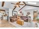 Open concept living room showing leather sofa and connection to updated kitchen at 1705 Sulgrave Rd, Charleston, SC 29414