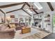 Living room featuring vaulted ceiling, fireplace, and a view of the outdoor landscape at 1705 Sulgrave Rd, Charleston, SC 29414