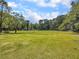 Community soccer field with picnic tables and trees surrounding the perimeter at 1705 Sulgrave Rd, Charleston, SC 29414