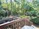 Beautiful backyard featuring lush landscaping, mature trees, and a charming fence at 1736 James Basford Pl, Mount Pleasant, SC 29466