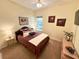 Comfortable bedroom with queen bed, side tables, and lots of natural light at 1736 James Basford Pl, Mount Pleasant, SC 29466