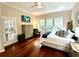 Cozy bedroom with lots of natural light, hardwood floors, and dresser at 1736 James Basford Pl, Mount Pleasant, SC 29466