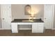 Home office with white cabinets and drawers, black countertop, overhead lighting, and two doors at 1736 James Basford Pl, Mount Pleasant, SC 29466