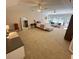Large main bedroom with multiple windows, ceiling fans and seating area at 1736 James Basford Pl, Mount Pleasant, SC 29466
