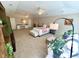 Spacious main bedroom with ceiling fans, seating area, vanity and ensuite bathroom at 1736 James Basford Pl, Mount Pleasant, SC 29466