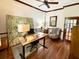Bright home office with wooden desk, comfortable chair, and decorative accents at 1736 James Basford Pl, Mount Pleasant, SC 29466