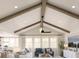 Bright and airy living room featuring vaulted ceilings, exposed beams, plush seating, and natural light at 2034 Mcguire Ln # 009, Hollywood, SC 29449