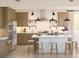 Modern kitchen with stainless steel appliances, a white island with seating, and stylish pendant lighting at 2038 Mcguire Ln # 010, Hollywood, SC 29449
