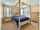 Comfortable bedroom featuring a four-poster bed, soft carpeting, and matching bedside tables at 204 Lynx Ln, Summerville, SC 29483