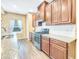 Modern kitchen with stainless steel appliances, granite countertops, and dark wood cabinetry at 204 Lynx Ln, Summerville, SC 29483