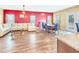 Spacious living room featuring hardwood floors, a comfortable sectional sofa, and a dining area at 204 Lynx Ln, Summerville, SC 29483