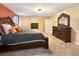 Comfortable main bedroom with neutral carpeting, dark wood furniture, and ample natural light at 204 Lynx Ln, Summerville, SC 29483