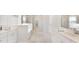 Bright bathroom featuring double vanities, a soaking tub, and a separate glass-enclosed shower at 206 Belfort Way, Summerville, SC 29486