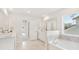 Bathroom with dual vanities, soaking tub, walk-in shower, and tile floors at 206 Belfort Way, Summerville, SC 29486