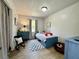 Bright bedroom features a playful color scheme, decor and natural light at 207 Longstreet St, Summerville, SC 29486