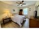Comfortable bedroom boasts neutral walls, ceiling fan and hardwood floors at 207 Longstreet St, Summerville, SC 29486