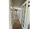 Well-lit hallway with wood floors and access to multiple rooms, creating a seamless flow at 207 Longstreet St, Summerville, SC 29486