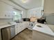 Well-lit kitchen with white cabinetry, modern appliances, and a view of the outdoors at 207 Longstreet St, Summerville, SC 29486